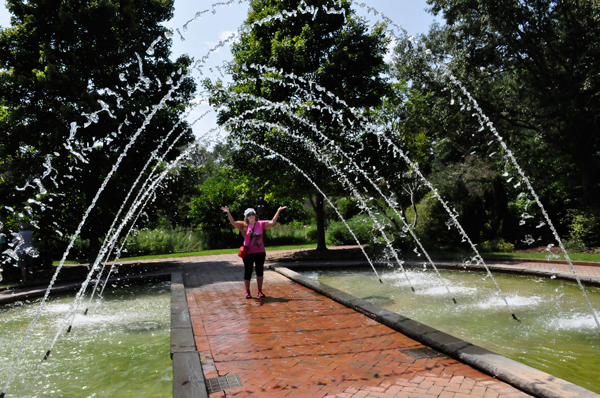 Karen Duquette getting wet at the water fountain